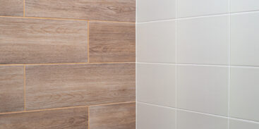 Wall tiles with light wood texture and white colour.