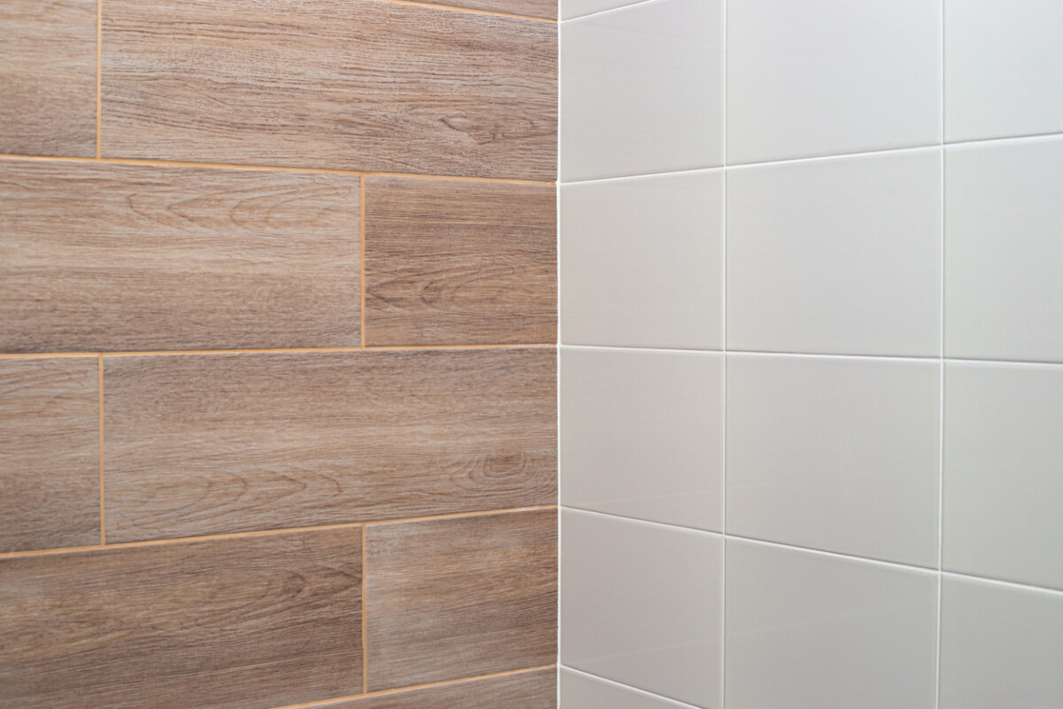 Wall tiles with light wood texture and white.