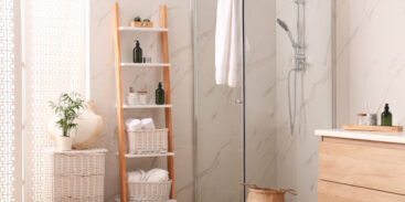 Modern wet room with a glass shower stall and decorative ladder shelf